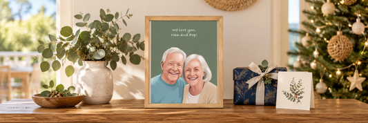 	Timber-framed Nan and Pop portrait beside a Christmas card and wrapped gift.
