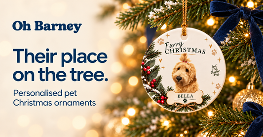 Personalised Bella pet Christmas ornament hanging on a tree beside “Their place on the tree”